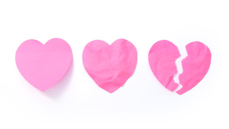 Heart shaped note paper isolated on white backgroundの写真素材