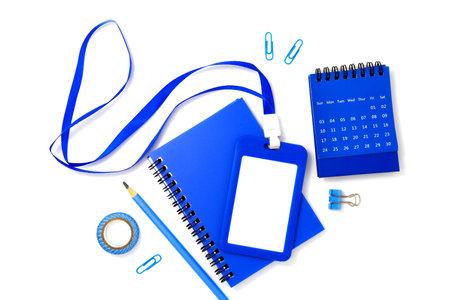 Blue plastic badge with book and calendar isolated on white background. Template designed for employees and guests of companyの写真素材