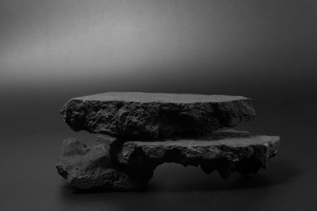Black stone podium plates product display pedestal. Rock black nature material for placing products fashion cosmeticsの写真素材