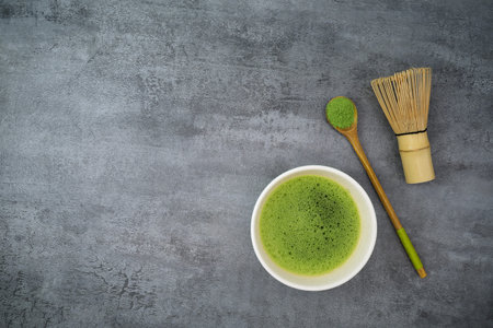 Green matcha kit on stone texture background. Copy space