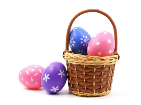 Colorful easter eggs in basket isolated on white background. Painted eggs. Egg Holiday