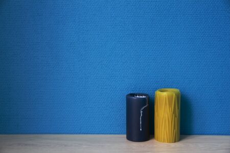 Color candles with blue wallpaperの写真素材