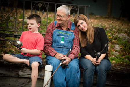 Mother and Son Fishing with Grandfather