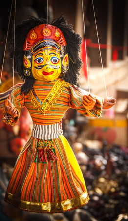 Souvenir puppets hanging to sell in the street shops of Bhaktapur.の写真素材