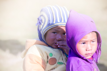 Chitlang,Nepal - Nov 8,2015:A beautiful portrait shot of two young childs of Nepali village.のeditorial素材