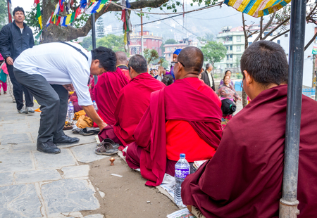 Kathmandu,Nepal - May 21,2016 : Monks are begging in Swayambhunath Stupa on Buddha's Birthday or Buddha Jayanti.のeditorial素材