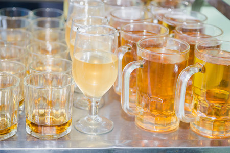 Glasses Filled with different Alcohol at the party: Beer,Wine,Whisky,Champange etc.の写真素材