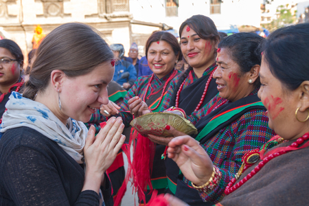 Kathmandu,Nepal - May  01,2017: A Tourist with Nepali women in Patan Kathmandu during Rato Machindranath Jatra Festival.のeditorial素材