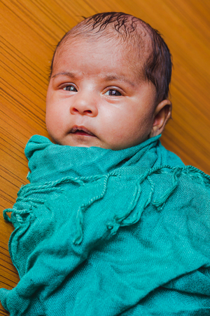 Closeup portrait of a beautiful sleeping newborn baby.Sleeping newborn asian baby girl.Nepalese baby girl.の写真素材