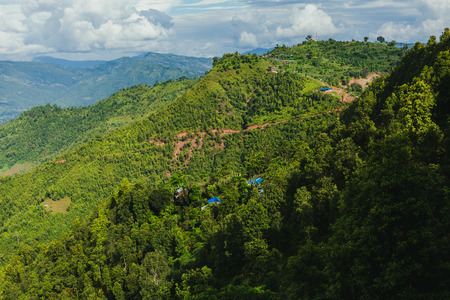 Scenery of beautiful Nepali rural village with mountains  and green forest.It is in the hilly region of Gorkha Nepal.Breathtaking view,Dramatic and picturesque scene. Popular tourist attraction destinations.の写真素材