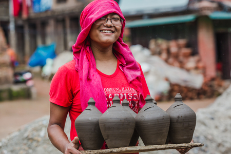 Bhaktapur,Nepal - August 4,2018 : Woman Working  with clay pot piggy bank  at Pottery  Square in Bhaktapur Nepal.のeditorial素材
