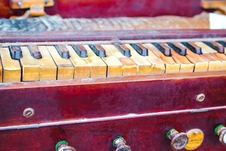 Close-up of  Shot of Traditional Old and Dusty Harmonium Keyboard.の写真素材