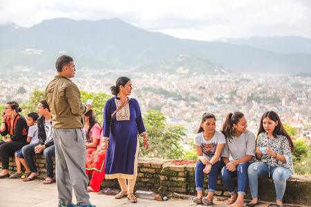 Kathmandu,Nepal - Aug 17,2018: Nepali people enjoying together with friends and families in Kritipur against beautiful background view of Kathmandu Valley.Asian People.のeditorial素材