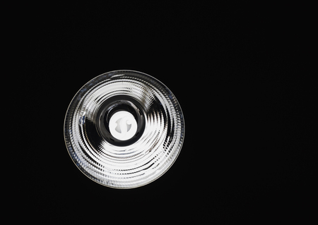 CFL Light Bulb in the Dark Ceiling background,bulb light background conceptの写真素材
