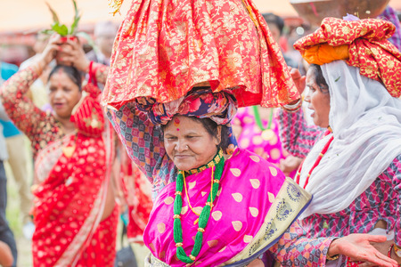 kathmandu,Nepal - Sep 3,2018:Women dancing with Carrying Gaura on their Heads on the occasion of Gaura Festival in Kathmandu.The Gaura Festival is celebrated by the Hindu peoples residing in the especially most of middle-western & far-western part of Nepaのeditorial素材