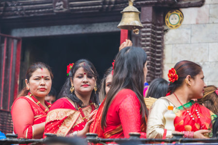 Kathmandu,Nepal - Sep 12,2018: Hindu Nepali women standing in line to worship goddess Shiva at...