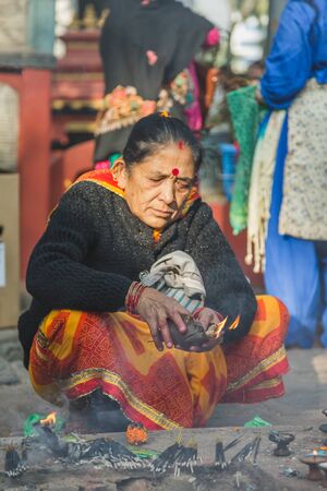 kathmandu,Nepal - Oct 13,2018: Hindu Prayers offering aarati or prayers to  god in the temple of  Kathmandu.のeditorial素材