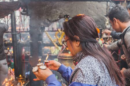 kathmandu,Nepal - Oct 13,2018: Hindu Prayers offering aarati or prayers to  god in the temple of  Kathmandu.のeditorial素材