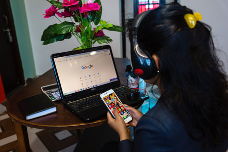 Kathmandu,Nepal - March 30,2020 : Young woman using a laptop to search google in Lockdown Period of...