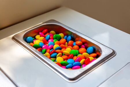 Colorful Candy in Ice Cream Counter.Chocolate Candy Backgroundの写真素材