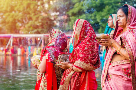 Kathmandu,Nepal - November 1,2019: Hindu devotees offering prayers to sun god standing in water according to hindu rituals during Chhath Puja Festival in Kathmandu. Chath Puja ritualsのeditorial素材