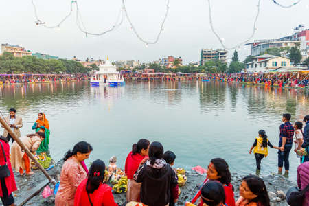 Kathmandu,Nepal - November 1,2019: Hindu devotees Celebrating Chhath Puja Festival at Kamal pokhari, Kathmandu. Chath Puja Celebrationのeditorial素材