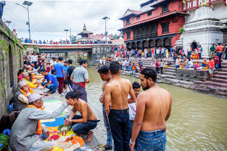 Kathmandu,Nepal - August 14,2019: Crowd of Hindu Prayers during Janai Purnima Rakshya Bandhan Festival in Pashupatinath Temple Premises,KKathmandu.のeditorial素材
