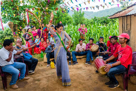 Kathmandu,Nepal - June 25,2019: Nepali People enjoying with local music and dance during wedding ceremony in rural village of Nepal.のeditorial素材