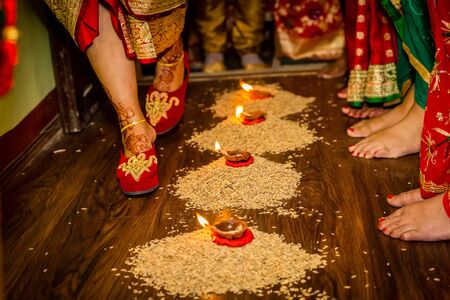 Hindu Marriage Wedding Ceremony,Nepali Wedding Rituals, Griha Prabesh,Bride entering groom's houseの写真素材
