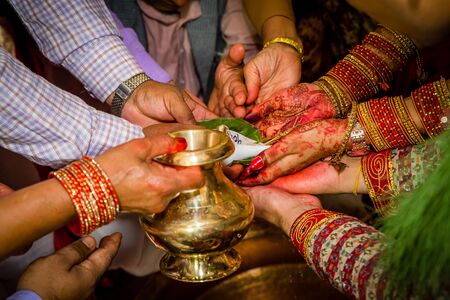 Details of Hindu marriage wedding ceremony.Hindu wedding Rituals.Focus on bride and groom's handの写真素材