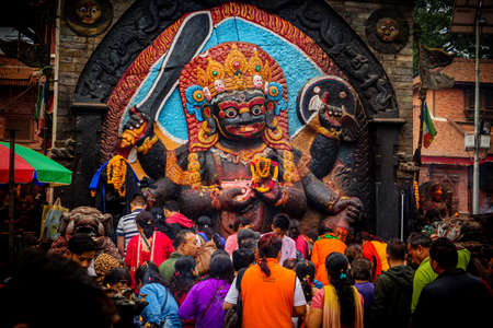 Kathmandu,Nepal - June 28,2019: Devotees worship Kal Bhairav which represents deity Shiva in his destructive manifestation. Hindu God Kal Bhairavのeditorial素材