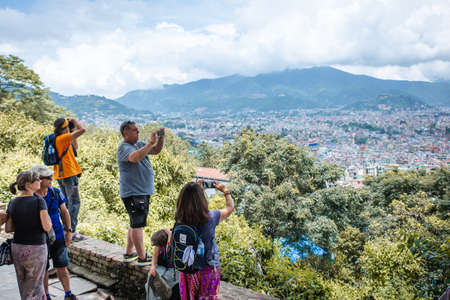 Kathmandu,Nepal - August 15,2019: Many Tourists taking photographs of Kathmandu Valley from Bagh Bhairav Temple in Kritipur.Tourist Travel Destinations In Nepal.のeditorial素材
