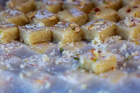 Fresh Indian sweets mithai from India prepared with milk,sugar and other ingredents. Burfi Sweet Dishの写真素材