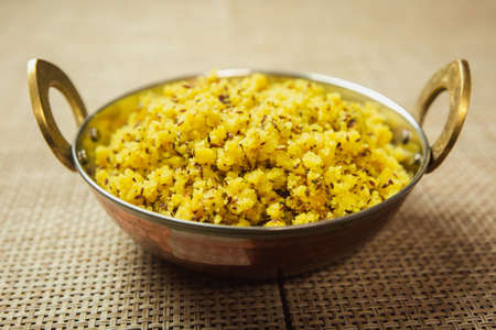 Suji Poha,Semolina Poha recipe cooked in Nepali Style served in a pot. Suji ko puwaの写真素材