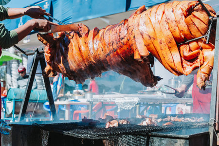 Whole Pork barbeque on a charcoal grill outdoor.の写真素材