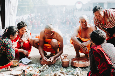 kathmandu, Nepal - April 20, 2023 : Hindu People performing rituals at the temple on the auspious occassion of Mother's day in Kathmandu.のeditorial素材
