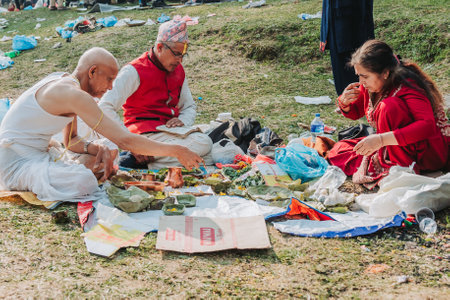kathmandu, Nepal - April 20, 2023 : Hindu People performing rituals at the temple on the auspious occassion of Mother's day in Kathmandu.のeditorial素材