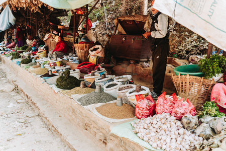 Kathmandu, Nepal - April 14, 2023 :People selling spices, nuts, Lentils and Vegetables at the street market in Kathmandu.のeditorial素材