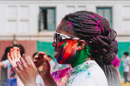 KATHMANDU, NEPAL - MARCH 6, 2023: Tourist celebrating Happy Holi festival at Basantapur Durbar Square in Kathmandu. Holi is a spring festival celebrated as a festival of colours.のeditorial素材