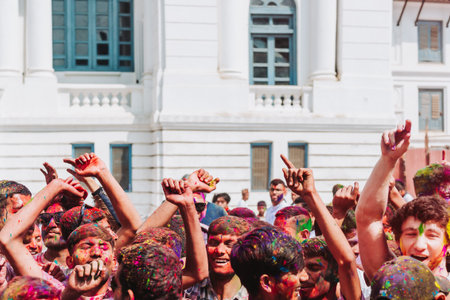 KATHMANDU, NEPAL - MARCH 6, 2023: People celebrating Happy Holi festival in Basantapur Durbar Square Kathmandu. Holi is a spring festival celebrated as a festival of colours.のeditorial素材