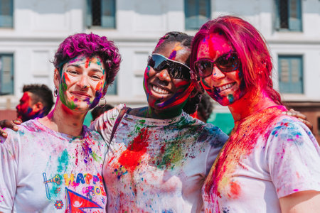 KATHMANDU, NEPAL - MARCH 6, 2023: Tourists enjoying Happy Holi festival at Basantapur Durbar Square in Kathmandu. Holi is a spring festival celebrated as a festival of colours.のeditorial素材