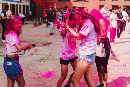 KATHMANDU, NEPAL - MARCH 6, 2023: Nepali People celebrating Happy Holi festival in Basantapur Durbar Square Kathmandu. Holi is a spring festival celebrated as a festival of colours.のeditorial素材