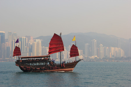 Traditional Wooden Sailboat sailing in Victoria Harbour in Hong Kongのeditorial素材
