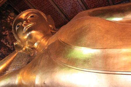Reclining Buddha at Wat Pho or Wat Phra Chettuphon Wimon Mangkhlaram Ratchaworamahawihan or Temple of the Reclining Buddha, one of famous landmarks in Bangkok, Thailand, well known as the birthplace of traditional Thai massageのeditorial素材