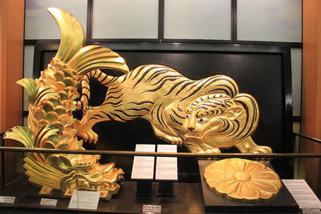 Osaka, Japan - May 28, 2013: Golden Tiger and Shachihoko, signs of the prestige and authority of the castle lord and were thought to protect the castle from fire, inside Osaka Castleのeditorial素材