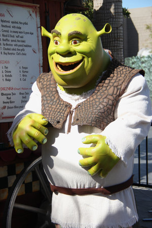 Los Angeles, California, USA - March 12, 2015: The movie character Shrek is taking photos with...