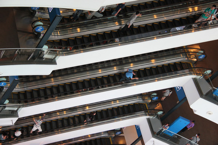 Bangkok Thailand  April 20 2015: Tourists are taking escalators up and down to different floors at a shopping center in Bangkok.のeditorial素材