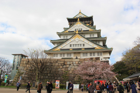 Osaka, Japan - April 8, 2015: Osaka Castle, widely known as an emblem of the power and fortune of Hideyoshi Toyotomi, is one of Japan's most famous and played a major rule in the unification of Japan during the 16th century of the Azuchi-Momoyama period.のeditorial素材
