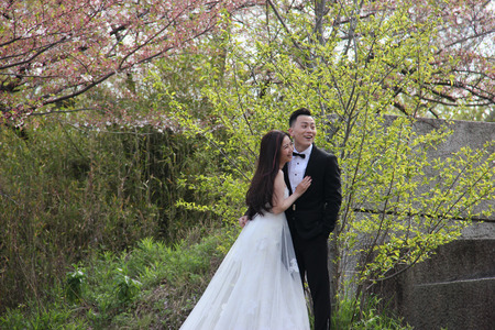 Osaka, Japan - April 8, 2015: Couples are taking pre-wedding photos together at Osaka Castle Park.のeditorial素材