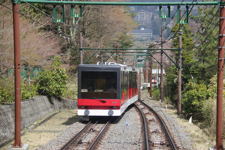 Hakone, Japan - April 9, 2015: Hakone Tozan Cable Car is a funicular railway racing effortlessly up the steep slope in Hakone. Hakone, Japan - April 9, 2015: Hakone Tozan Cable Car is a funicular railway racing effortlessly up the steep slope in Hakone.